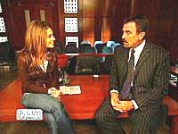 Tom Selleck on Boston Legal set with Maria Menounos of Access Hollywood