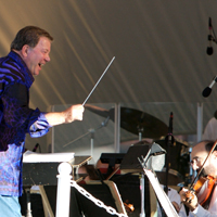 Actor William Shatner was all elbows, wielding his conductor's baton before the Boston Pops Esplanade Orchestra